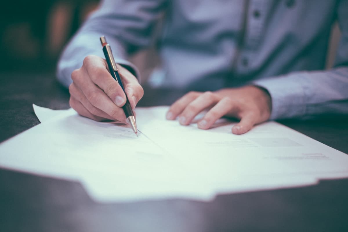 Professional reviewing insurance documentation at a desk